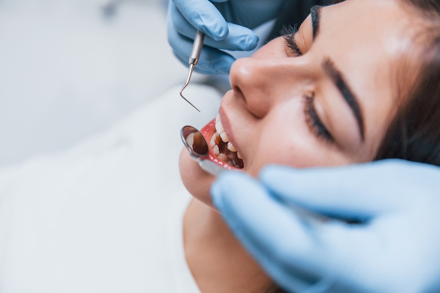 Close up view of young adult woman that have a visit in the dentist clinic